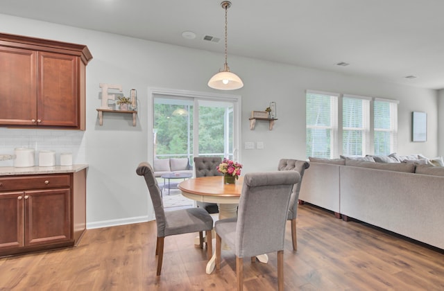 dining room with hardwood / wood-style flooring