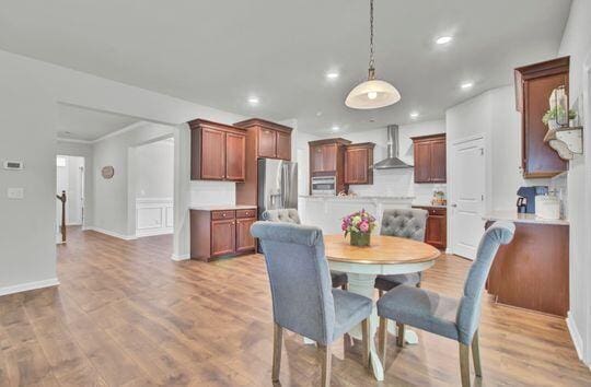 dining area with light wood-type flooring