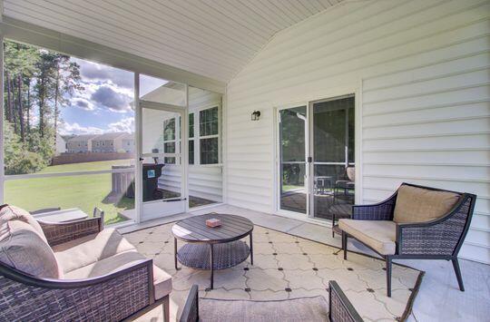 sunroom with lofted ceiling and wood ceiling