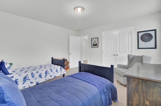 carpeted bedroom with a closet