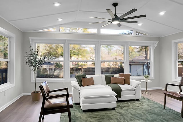 sunroom / solarium with lofted ceiling and ceiling fan