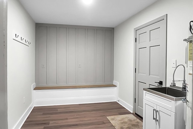 mudroom with sink and dark hardwood / wood-style flooring