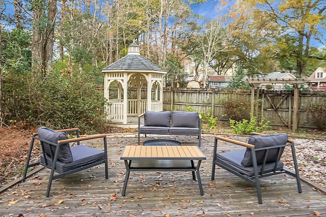 wooden deck with a gazebo and an outdoor living space