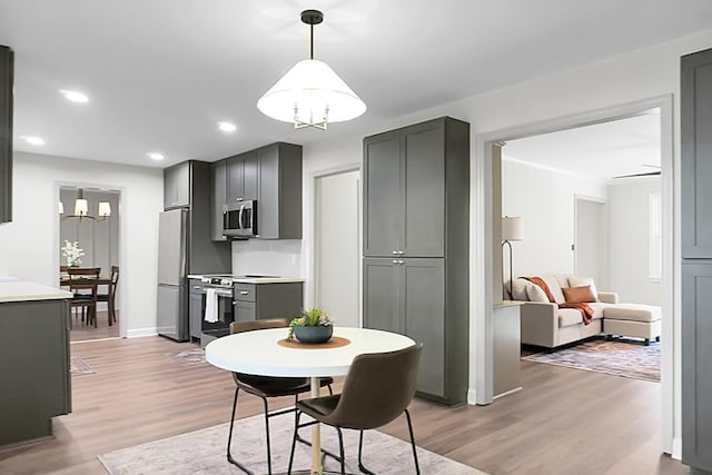 dining space with light hardwood / wood-style floors