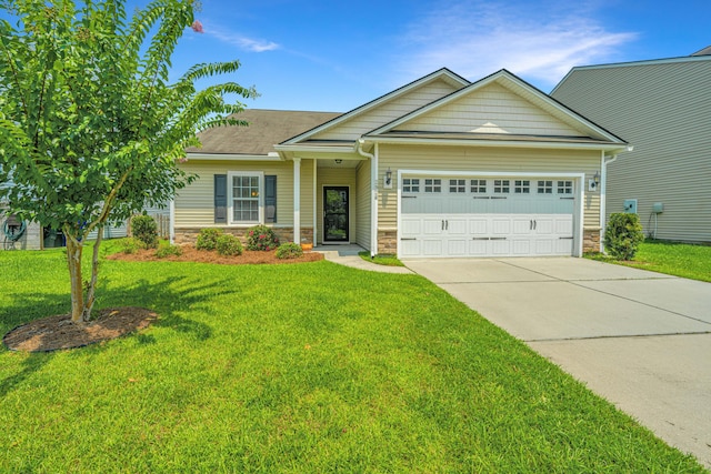 view of front of property with a garage and a front yard