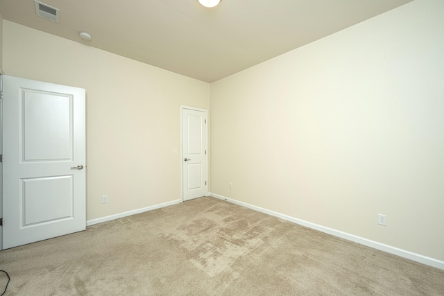 unfurnished room featuring carpet