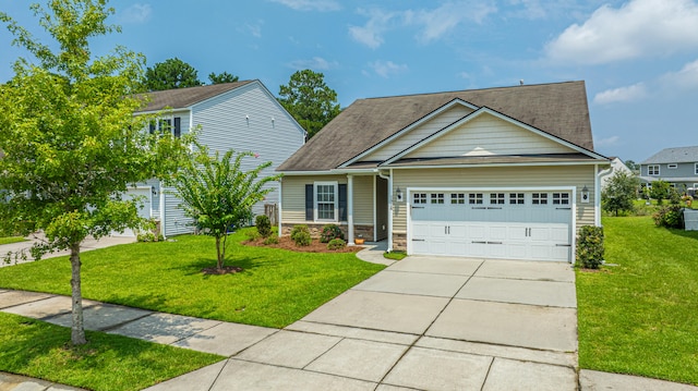 view of front of home with a garage and a front yard