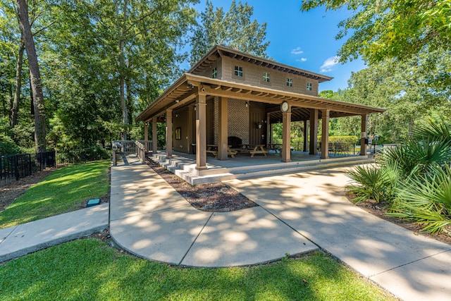 view of community featuring a patio and a yard