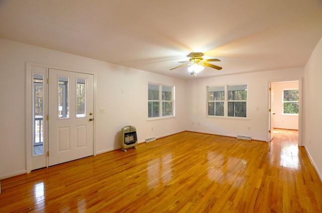 entryway featuring visible vents, ceiling fan, a wealth of natural light, and light wood-style floors