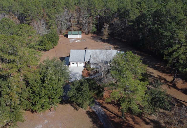 drone / aerial view featuring a view of trees