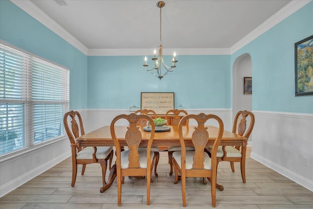 144 Back Tee Cir, Summerville, SC 29485 - dining room with arched walkways, ornamental molding, light wood-style flooring, and an inviting chandelier