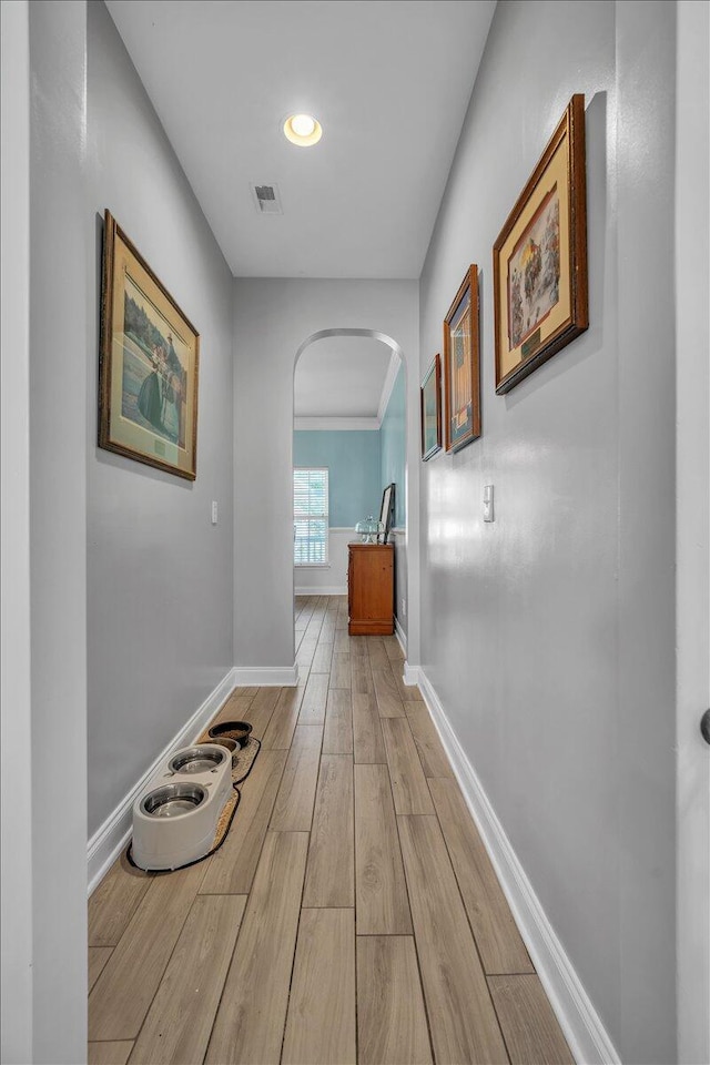 144 Back Tee Cir, Summerville, SC 29485 - hallway with arched walkways, visible vents, baseboards, and light wood-style floors