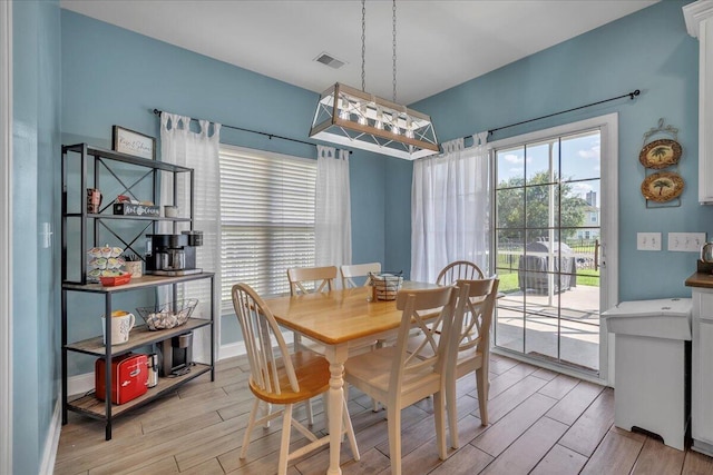 144 Back Tee Cir, Summerville, SC 29485 - dining space featuring visible vents, baseboards, and wood tiled floor