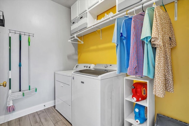 144 Back Tee Cir, Summerville, SC 29485 - washroom with baseboards, cabinet space, light wood-style flooring, and separate washer and dryer