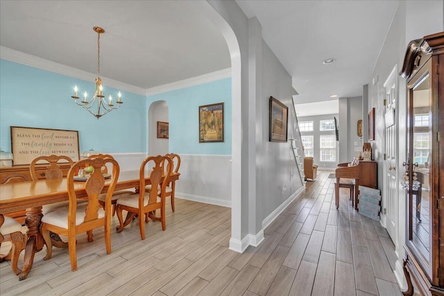144 Back Tee Cir, Summerville, SC 29485 - dining space with arched walkways, crown molding, light wood-style floors, and a notable chandelier