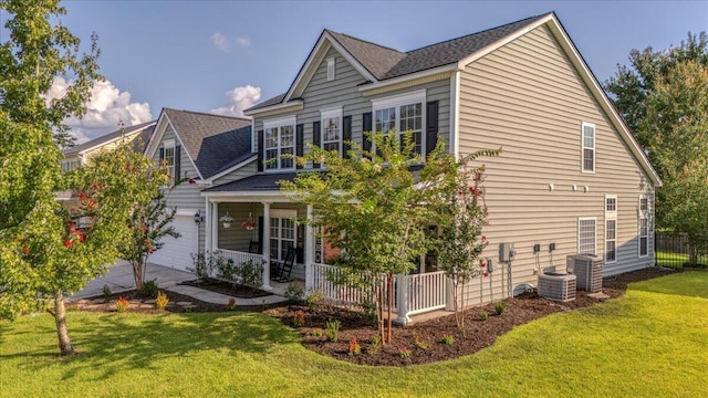 144 Back Tee Cir, Summerville, SC 29485 - view of home's exterior featuring covered porch, central AC, a garage, and a lawn