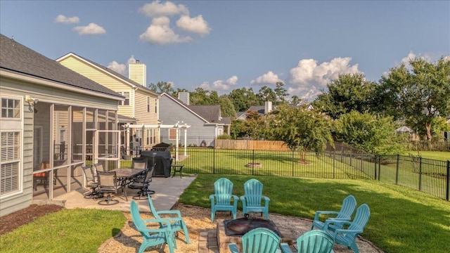144 Back Tee Cir, Summerville, SC 29485 - view of yard with a patio, a sunroom, an outdoor fire pit, and a fenced backyard