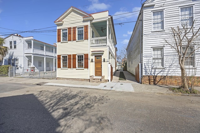 view of front of home featuring a balcony