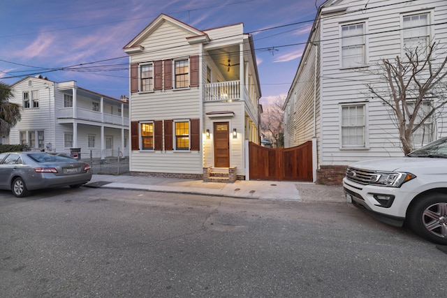 view of front of house featuring fence