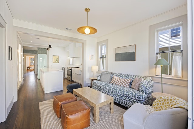 living room with visible vents and dark wood-style flooring