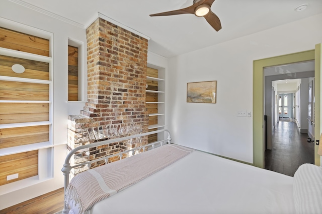 bedroom with ceiling fan and wood finished floors