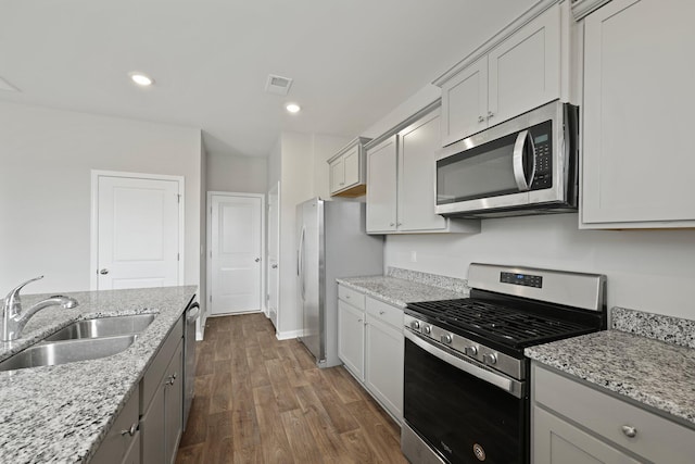 183 Greenwich Dr, Summerville, SC 29486 - kitchen featuring dark wood finished floors, light stone countertops, visible vents, a sink, and stainless steel appliances
