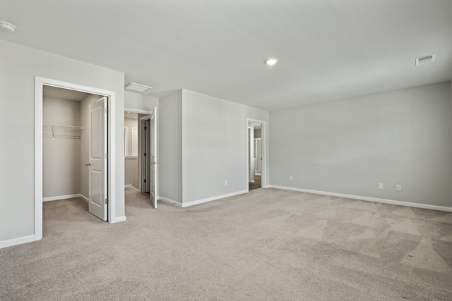 183 Greenwich Dr, Summerville, SC 29486 - unfurnished bedroom featuring baseboards, light carpet, recessed lighting, a walk in closet, and visible vents