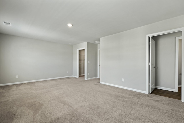 183 Greenwich Dr, Summerville, SC 29486 - unfurnished bedroom with a walk in closet, baseboards, visible vents, and carpet floors