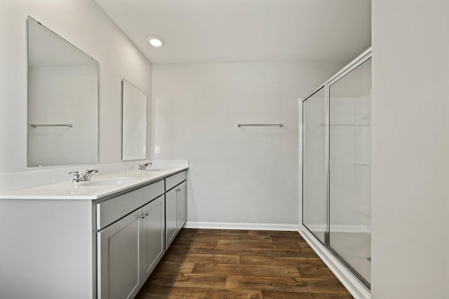 183 Greenwich Dr, Summerville, SC 29486 - full bathroom with double vanity, a sink, a stall shower, and wood finished floors