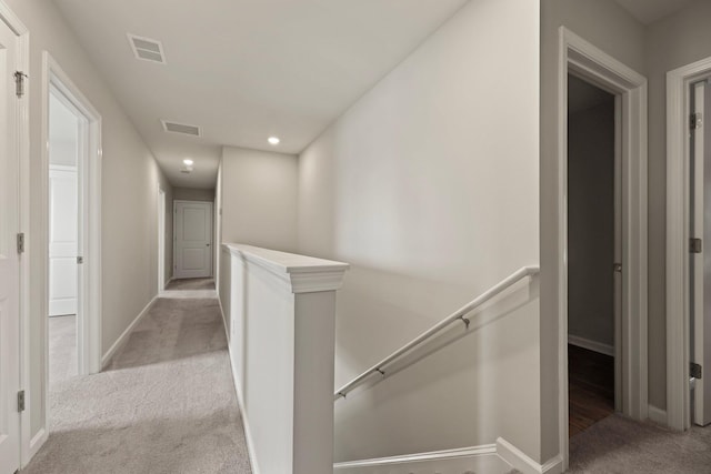 183 Greenwich Dr, Summerville, SC 29486 - hallway featuring light carpet, an upstairs landing, visible vents, and baseboards