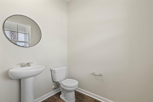 183 Greenwich Dr, Summerville, SC 29486 - bathroom with baseboards, a sink, toilet, and wood finished floors