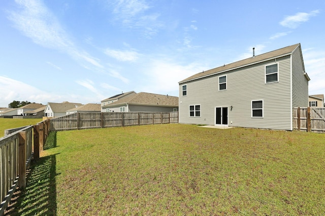 183 Greenwich Dr, Summerville, SC 29486 - rear view of house with a fenced backyard and a lawn