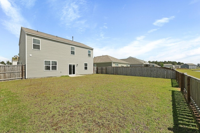 183 Greenwich Dr, Summerville, SC 29486 - rear view of house with a yard and a fenced backyard