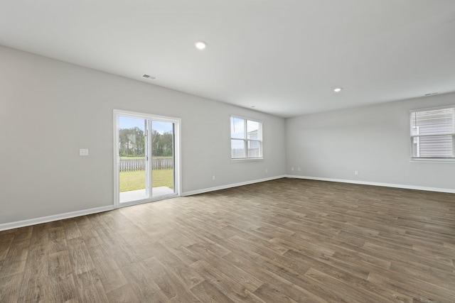 183 Greenwich Dr, Summerville, SC 29486 - unfurnished living room featuring visible vents, baseboards, and wood finished floors