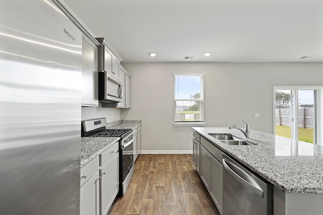 183 Greenwich Dr, Summerville, SC 29486 - kitchen with gray cabinets, dark wood-style flooring, a sink, stainless steel appliances, and plenty of natural light