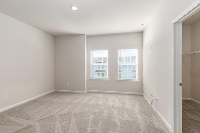 304 Pathfinder Way, Charleston, SC 29492 - unfurnished bedroom with light colored carpet, baseboards, a walk in closet, and recessed lighting