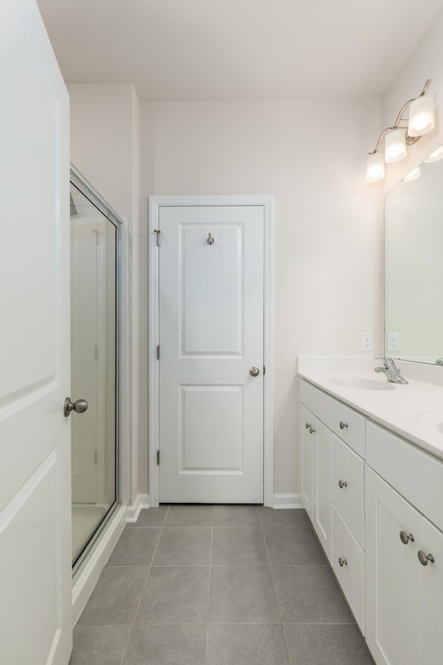 304 Pathfinder Way, Charleston, SC 29492 - bathroom with double vanity, tile patterned flooring, a stall shower, and baseboards
