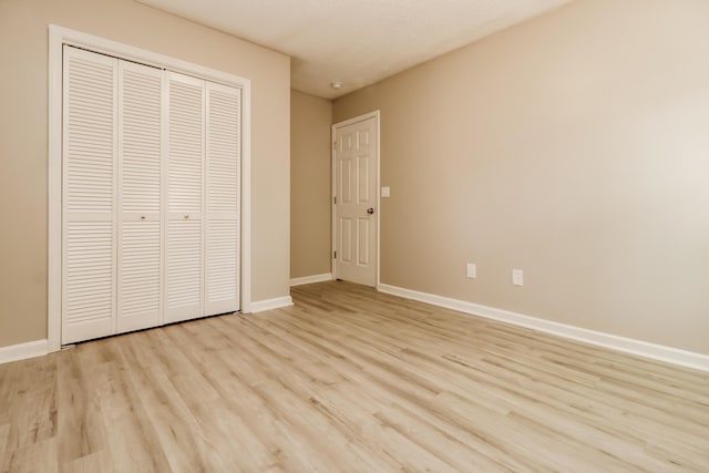 258 Trickle Dr, Summerville, SC 29483 - unfurnished bedroom featuring light wood finished floors, baseboards, and a closet
