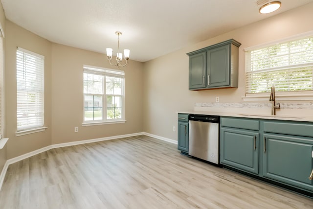258 Trickle Dr, Summerville, SC 29483 - kitchen with stainless steel dishwasher, a sink, light wood-style flooring, a chandelier, and light countertops