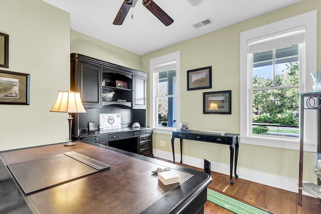 office area with light hardwood / wood-style flooring and ceiling fan