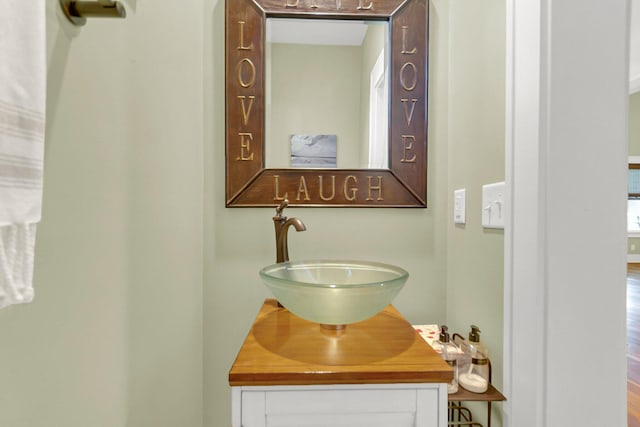 bathroom featuring vanity and hardwood / wood-style floors