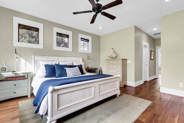 bedroom with dark wood-type flooring and ceiling fan