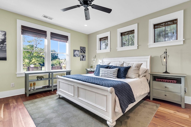 bedroom with hardwood / wood-style flooring and ceiling fan