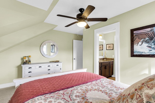 bedroom with ensuite bathroom, ceiling fan, lofted ceiling, and light colored carpet