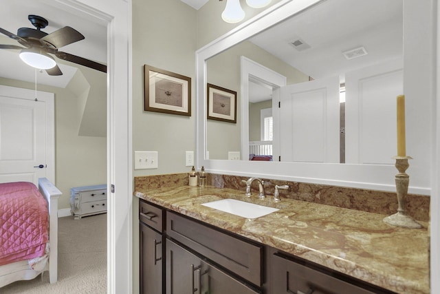 bathroom with ceiling fan and vanity