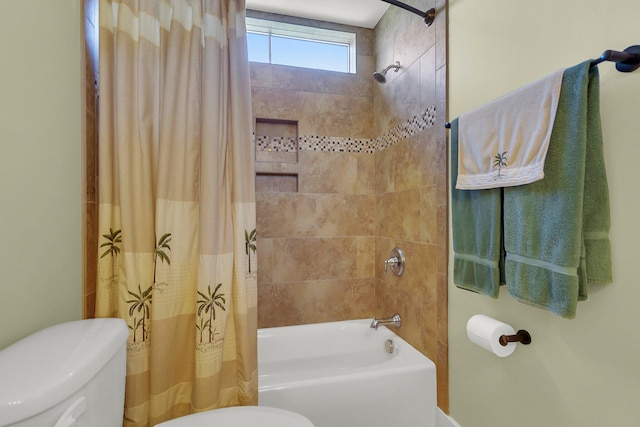 bathroom featuring toilet and shower / tub combo