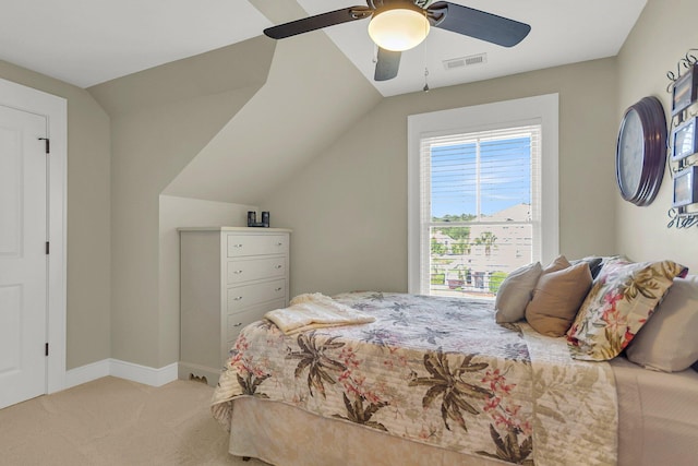 bedroom featuring ceiling fan, light carpet, and lofted ceiling