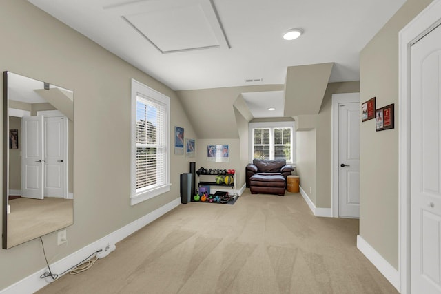 sitting room with plenty of natural light and light colored carpet