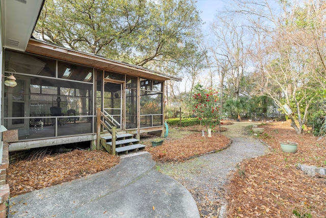 view of yard with a sunroom