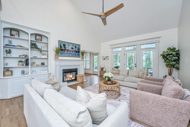 1143 Sea Eagle Watch, Charleston, SC 29412 - living area with high vaulted ceiling, light wood finished floors, ceiling fan, and a brick fireplace